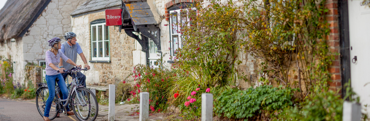 Cyclists in Bembridge village, Isle of Wight